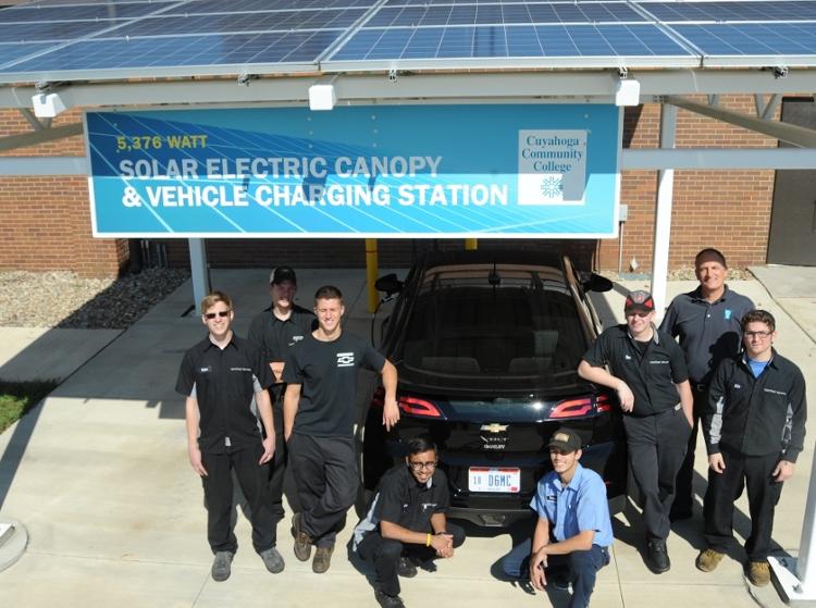 A 5.376 kilowatt solar electric array at the Advanced Automotive Technology Center at Western Campus generates approximately 6,100 kWh of clean electricity annually and shades an electric vehicle charging station.