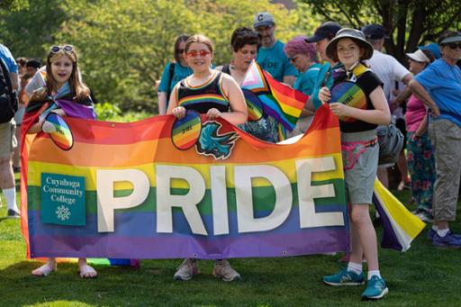 Students with the Tri-C pride banner at CLE Pride 2023