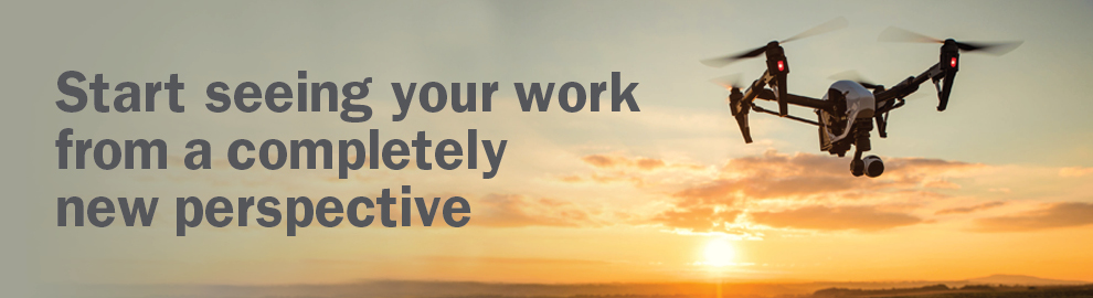 Image of drone with skyline with words - Start seeing your work from a completely new perspective