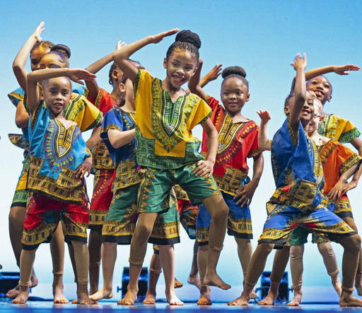 Image of children dancing on stage