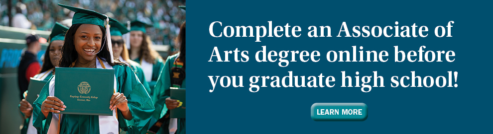 Smiling Tri-C graduate holding diploma
