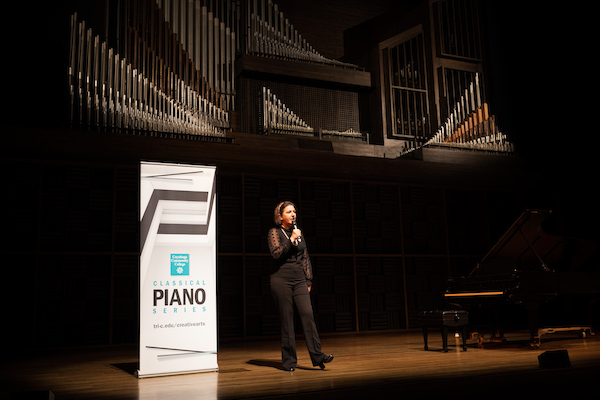 Woman making annoucement on stage