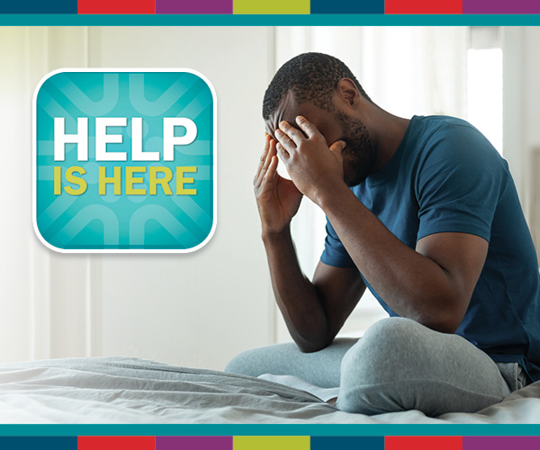 Image of male with hands on his head struggling with mental health