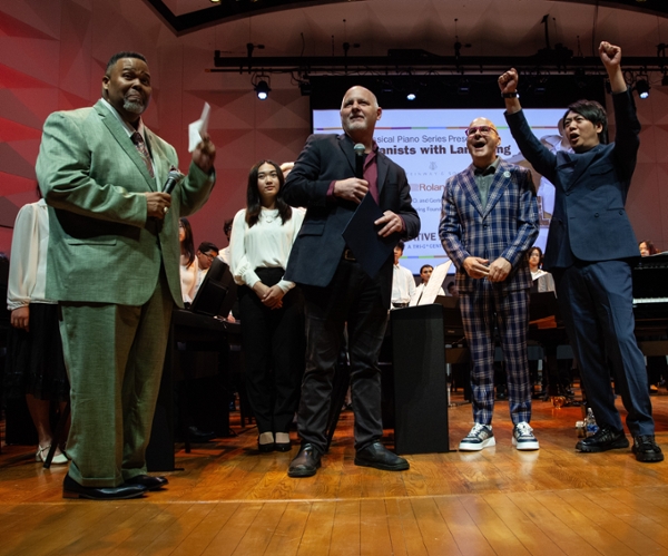 From left, Michael A. Baston of Tri-C, Jeffrey Allen of CMSD, Leszek Barwiński-Brown of the Lang Lang International Music Foundation, and pianist Lang Lang
