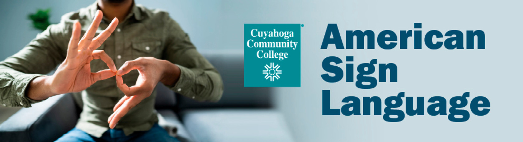 Man signing using American Sign Language the term for "interpret."