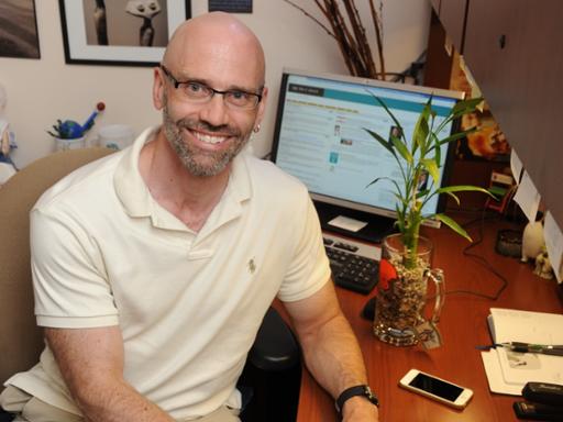 Professor Justin Miller reduces waste in the classroom through the use of technology.