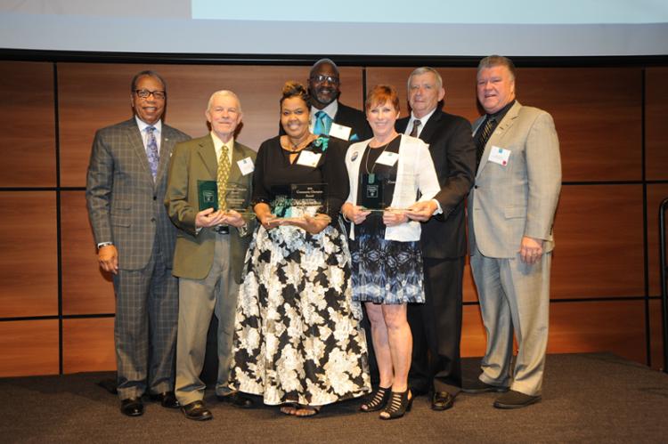 Tri-C President Alex Johnson and The Illuminating Company President John Skory on stage with winners.