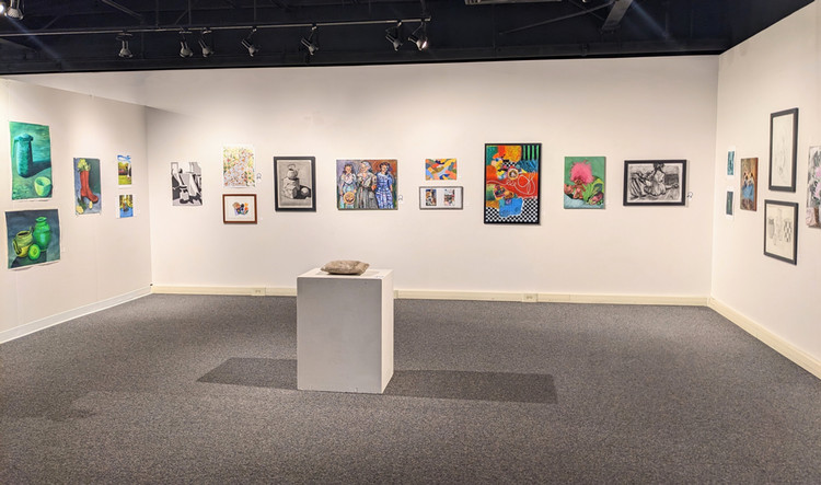 artwork on gallery walls and pedestals