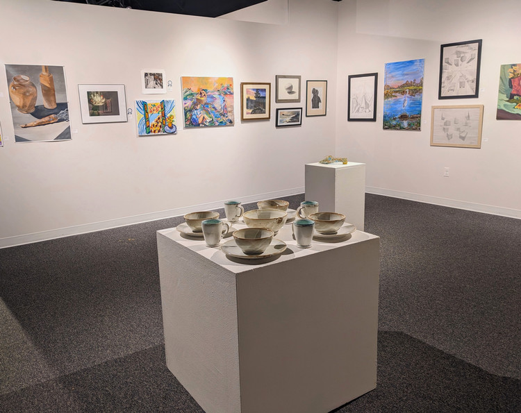 artwork on gallery walls and pedestals