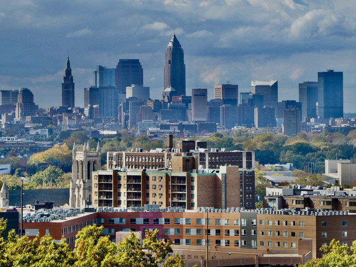 Angeli Person's photo, "Cleveland City View," depicting the Cleveland city skyline against a blue sky