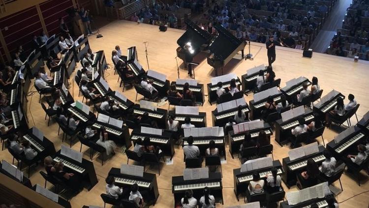 Image of pianists on a concert stage