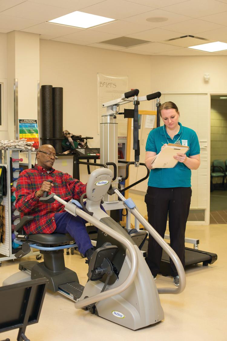 OT cutting bread with patient