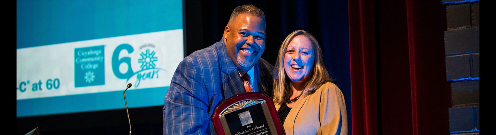 Dr. Baston handing over the President's Award.