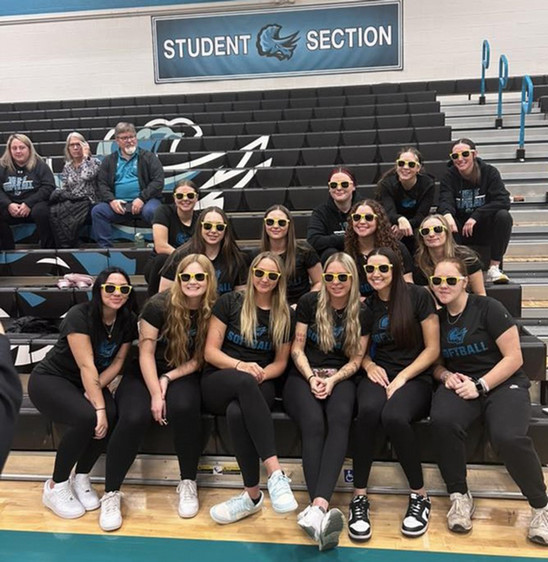 Female student athletes in uniform wearing sunglasses