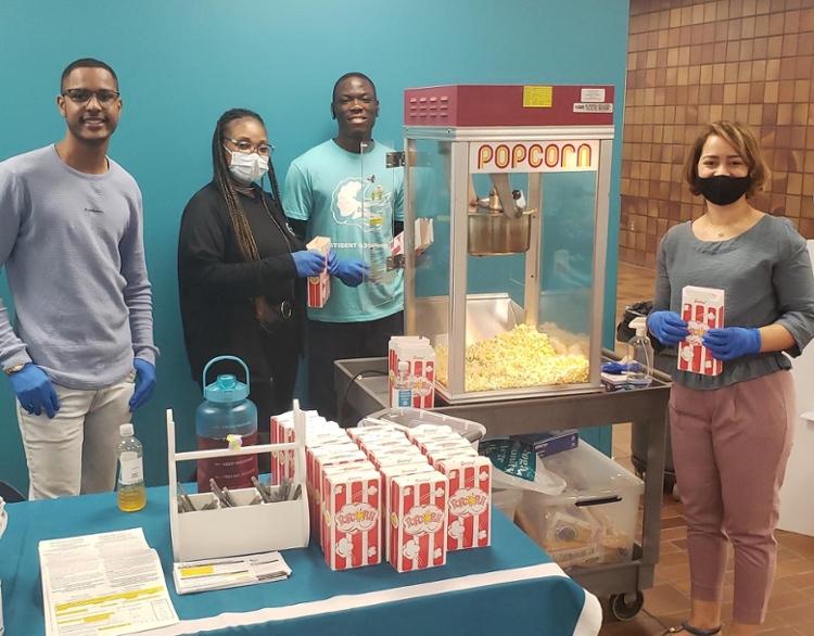 East Campus students with popcorn machine on Tri-C Day