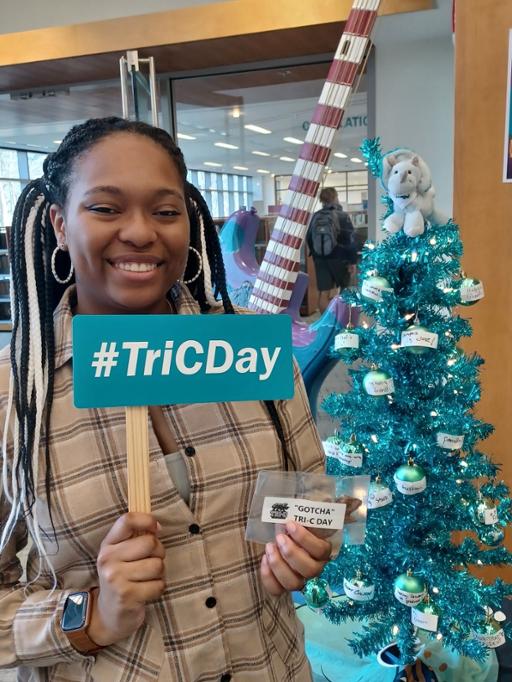 Westshore student with its "giving tree" and #TriCDay message