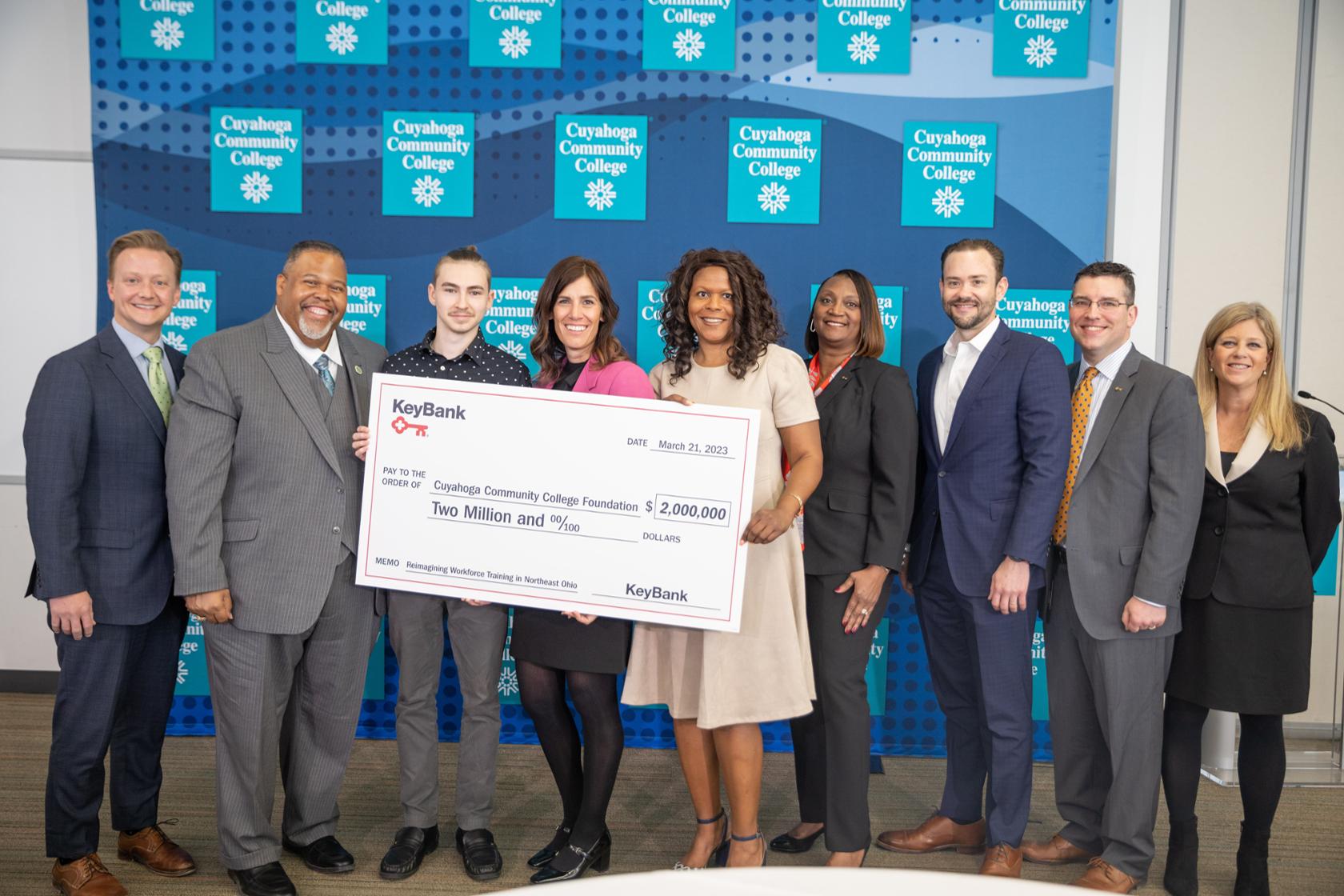 KeyBank and Tri-C leadership standing behind an oversized ceremonial check representing the two million dollar grant