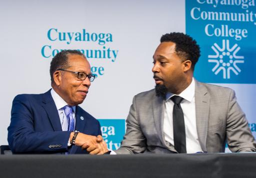 Tri-C President Alex Johnson (left) shakes hands with the Rev. Jawanza Colvin of Olivet Institutional Baptist Church following the signing of a memorandum of understanding creating a Tri-C Access Center in partnership with the church.