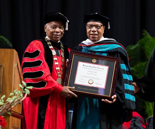Alex Johnson receiving honorary doctorate