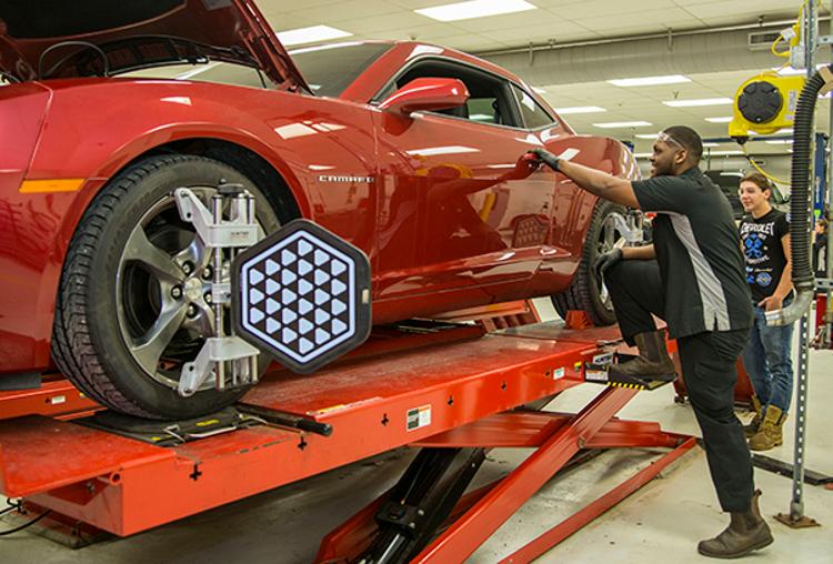 Students in Tri-C's GM ASEP program work on a Chevrolet Camaro at the Western Campus' Advanced Automotive Technology Center.
