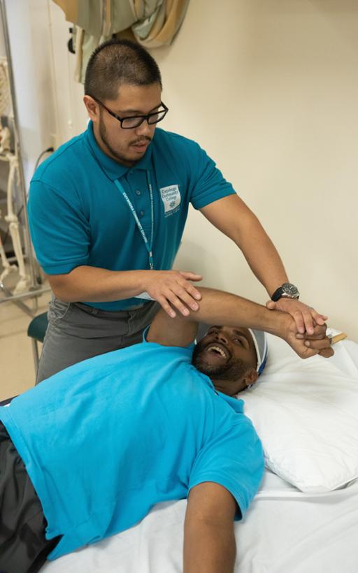 Tri-C student working with a client at the Preventative Care Center