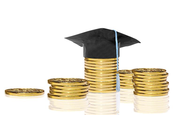 Stacks of coins with graduation cap