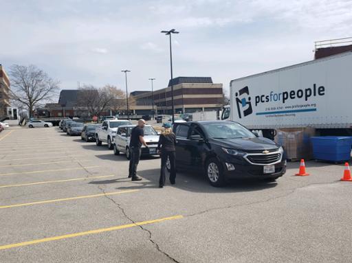 Cars waiting in line at Metro Campus for computer distribution