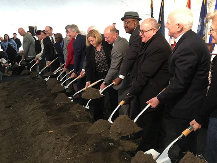 City and federal officials, and members of the Greater Cleveland Fisher House fundraising campaign, turn the first shovels of dirt on the construction of two new Fisher Houses during a groundbreaking ceremony on Friday, March 23, 2018. (Brian Albrecht/The Plain Dealer)