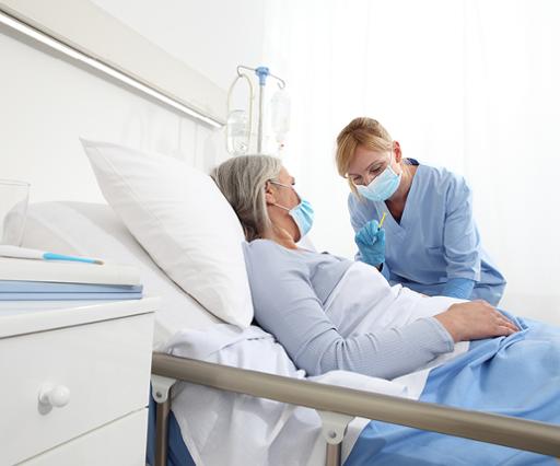Health care worker assisting patient