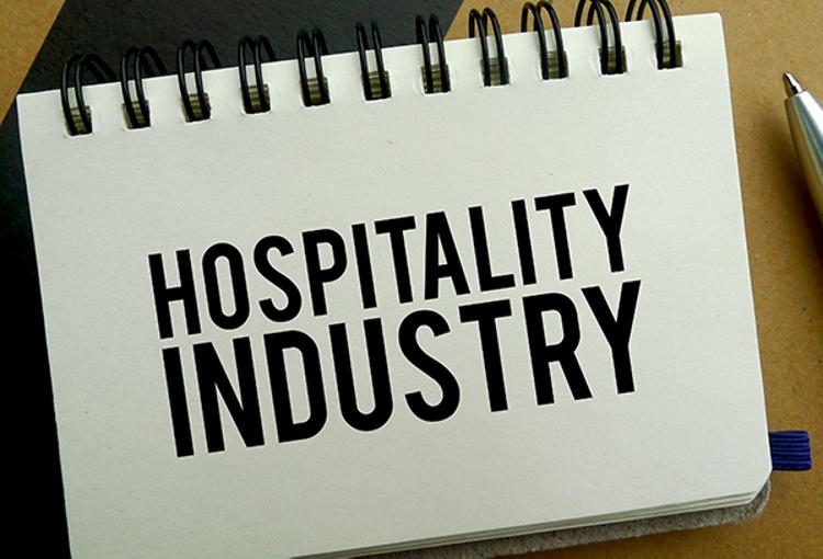Hospitality Industry written on notepad