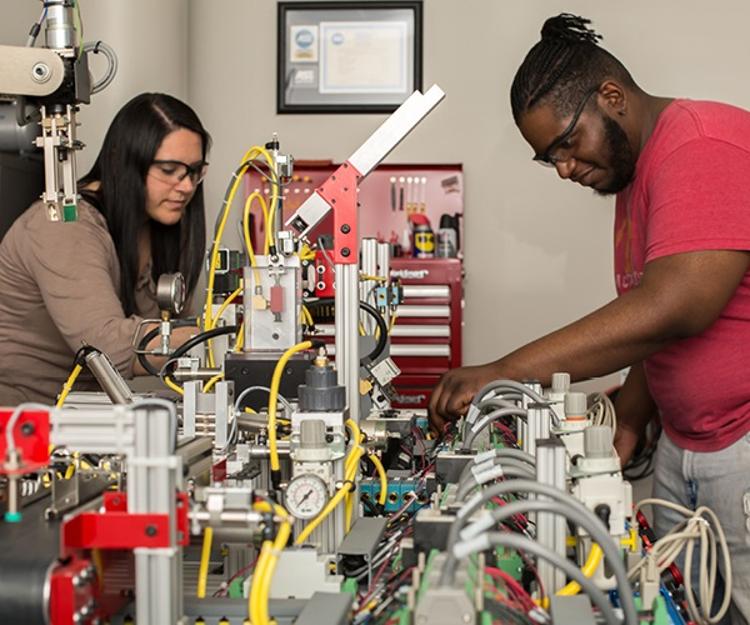 Two students working in a technology lab