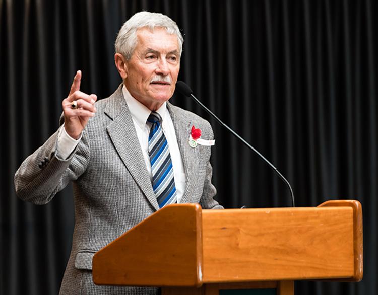 James Banks speaking at podium