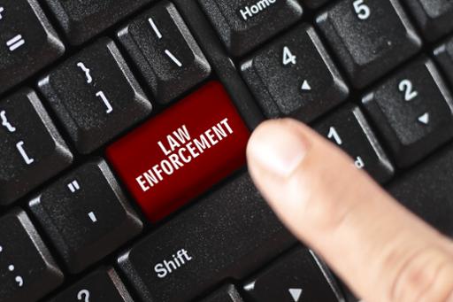 Computer keyboard with red 'Law Enforcement' button