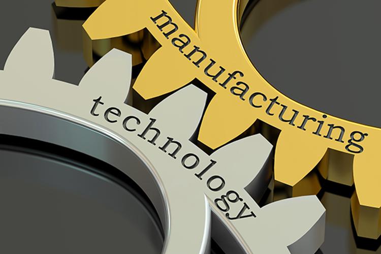Gears interlocking with "manufacturing" and "technology written on them.