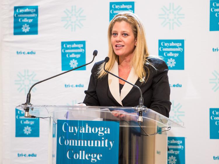 Megan O'Bryan speaking at a podium