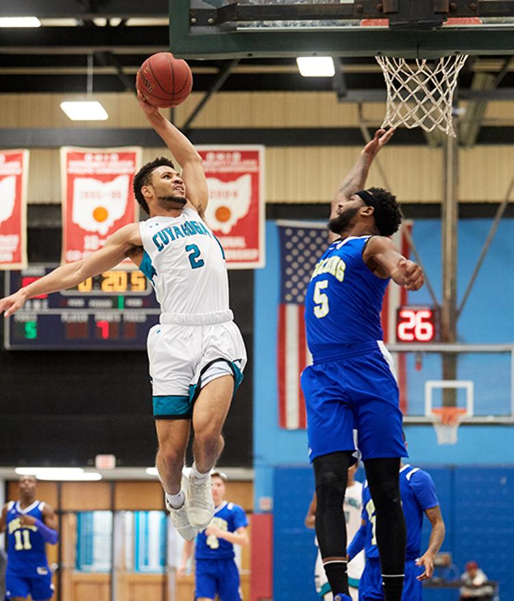 Tri-C's Josawah Bradford flies in for a dunk during a February game against Hocking College.