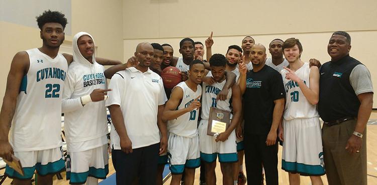 The Tri-C men's basketball team celebrates after winning the Region XII championship Saturday in Circleville, Ohio.