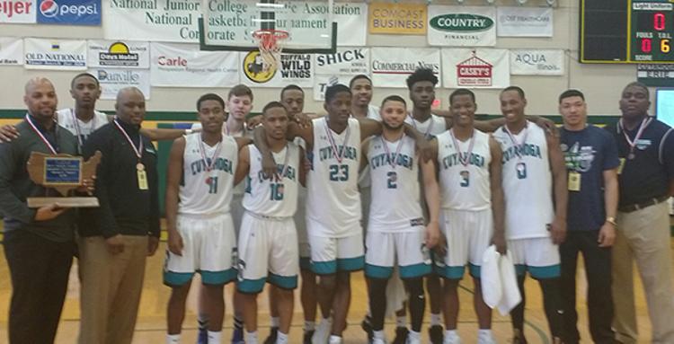 The Tri-C men's basketball team with their medals and trophy, following their victory over Grand Rapids Community College Saturday.