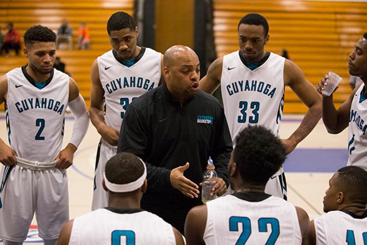 Tri-C men's basketball head coach Michael Duncan huddles with his players during a December game.