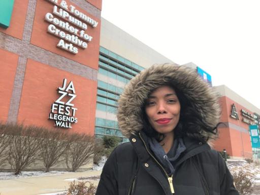 Phoebe Lee outside Tri-C's Gill and Tommy LiPuma Center for Creative Arts at Metropolitan Campus