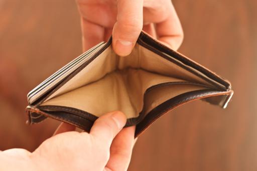 Hands holding open an empty wallet