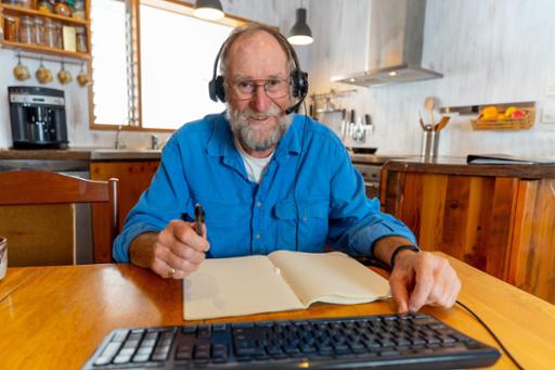 Older man with a computer