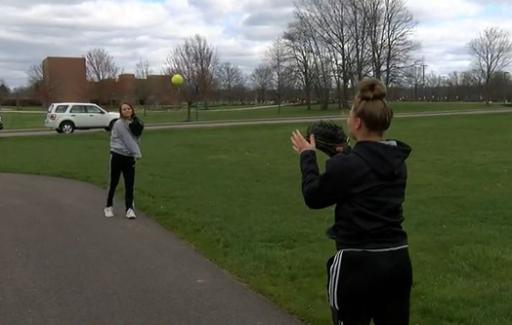Breanna Musick and Cassandra Fendrick playing catch.