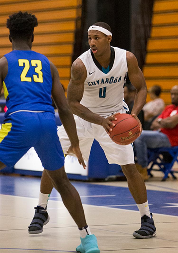 Tri-C basketball player Devon Robinson game action shot