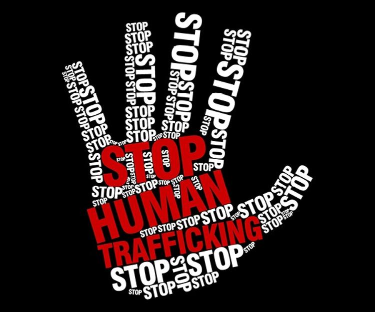 Graphic of hand composed of words "stop human trafficking."