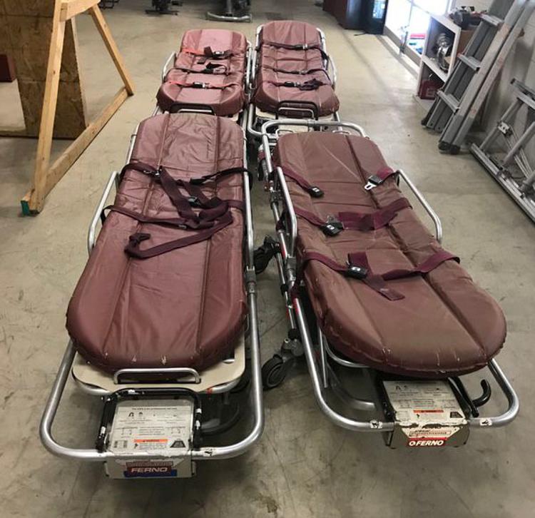 Four manually-operated stretchers