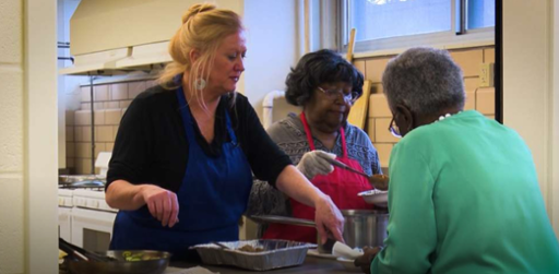Tri-C grad Susie Porter teaching residents at a Cleveland Metropolitan Housing Authority high rise how to cook healthier. Photo from ideastream.org.