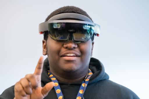 Young man wearing HoloLens equipment