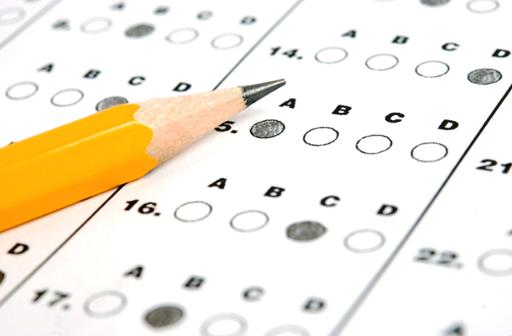 Photo illustration of a pencil on a testing bubble sheet