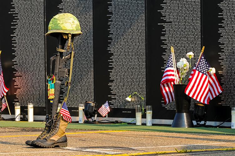 Soldier memorial with traveling Vietnam Wall